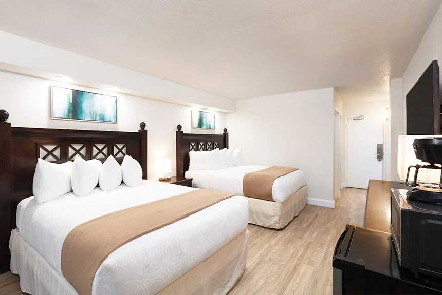 View from the entry of a Westgate Myrtle Beach Oceanfront double amusement park view room with two beds and a TV
