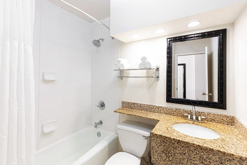 Bathroom in a Westgate Myrtle Beach Oceanfront double oceanfront room with a granite vanity and tub-shower