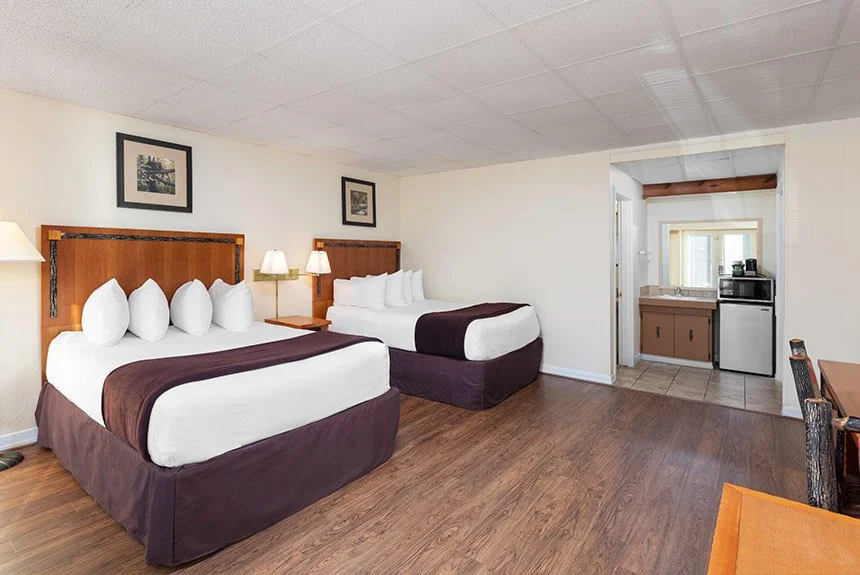 River Terrace Resort hotel room with two beds and a vanity area with a mini fridge and microwave