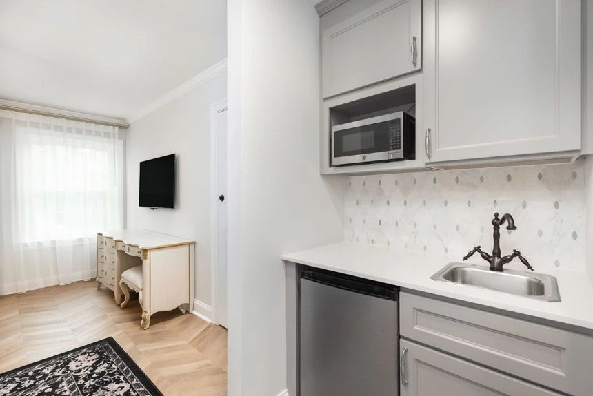 Kitchenette with gray cabinets, microwave and mini fridge in a Westgate Historic Williamsburg Resort studio villa