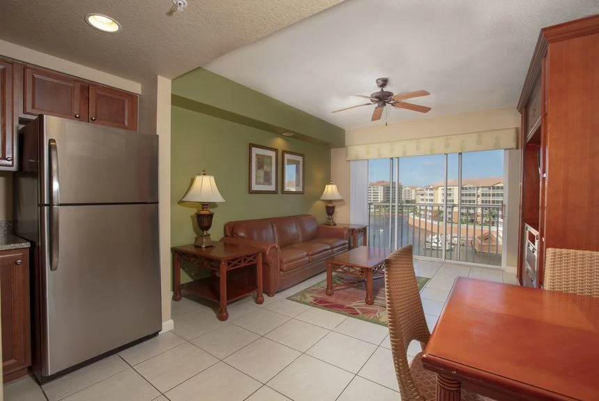 Westgate Town Center Resort studio deluxe with a stainless refrigerator, leather sofa and balcony doors