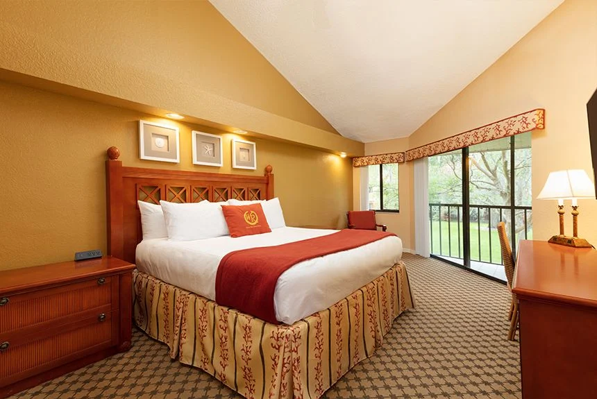Bedroom in a Westgate Vacation Villas Resort two-bedroom villa with loft, with a vaulted ceiling and sliding glass doors