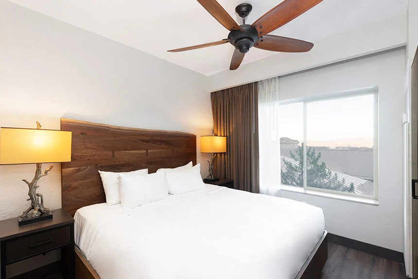 Second bedroom of a Westgate Park City Resort & Spa two-bedroom villa with a live-edge headboard and window view