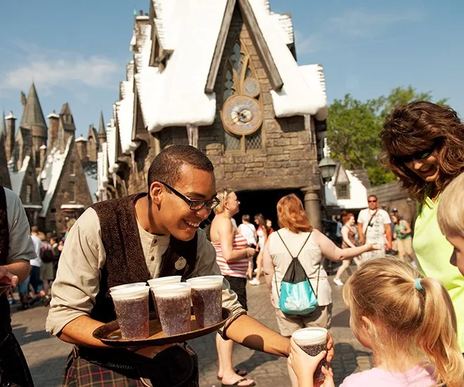 Server handing out drinks to guests at The Wizarding World of Harry Potter, Universal Orlando