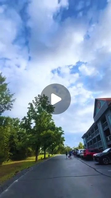 Baymont by Wyndham Branson Thousand Hills on Instagram: tree-lined drive beside the hotel under a cloudy sky