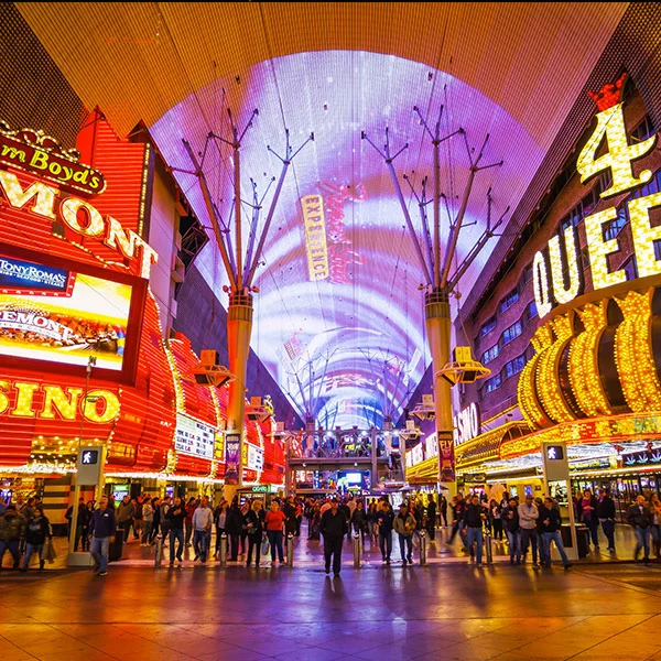 Crowds under the lit canopy of the Fremont Street Experience in downtown Las Vegas