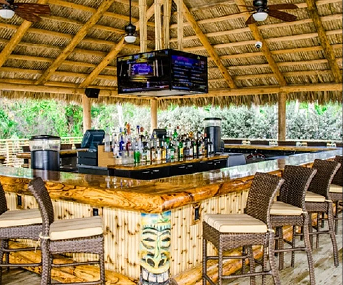 The tiki-roofed bar inside Longboards restaurant in Cocoa Beach
