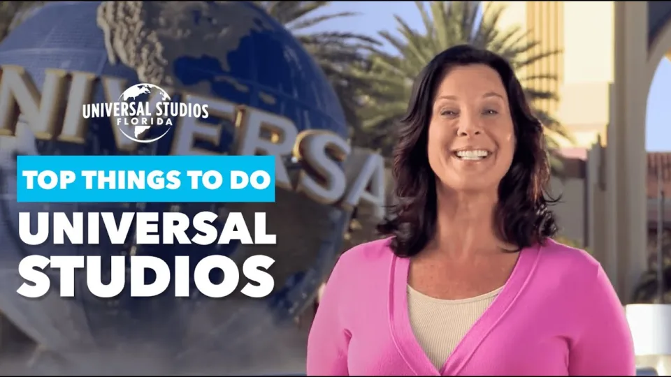 Host smiling in front of the Universal Studios globe beside the title Top Things to Do Universal Studios, a frame from the video