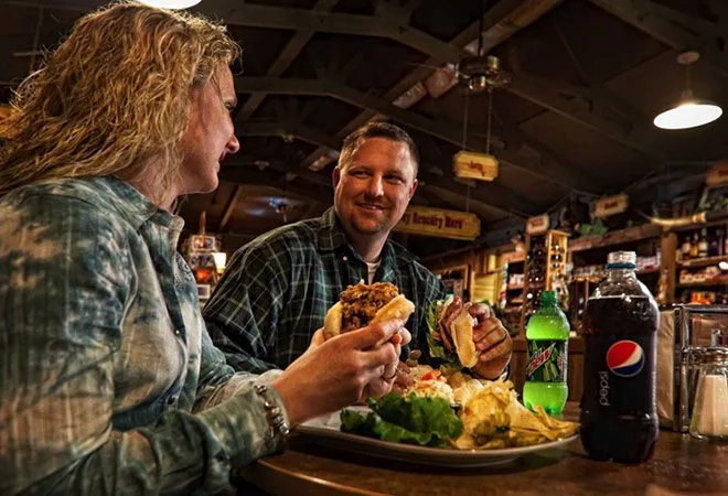 Couple eating sandwiches at the deli in the General Store at Westgate River Ranch Resort