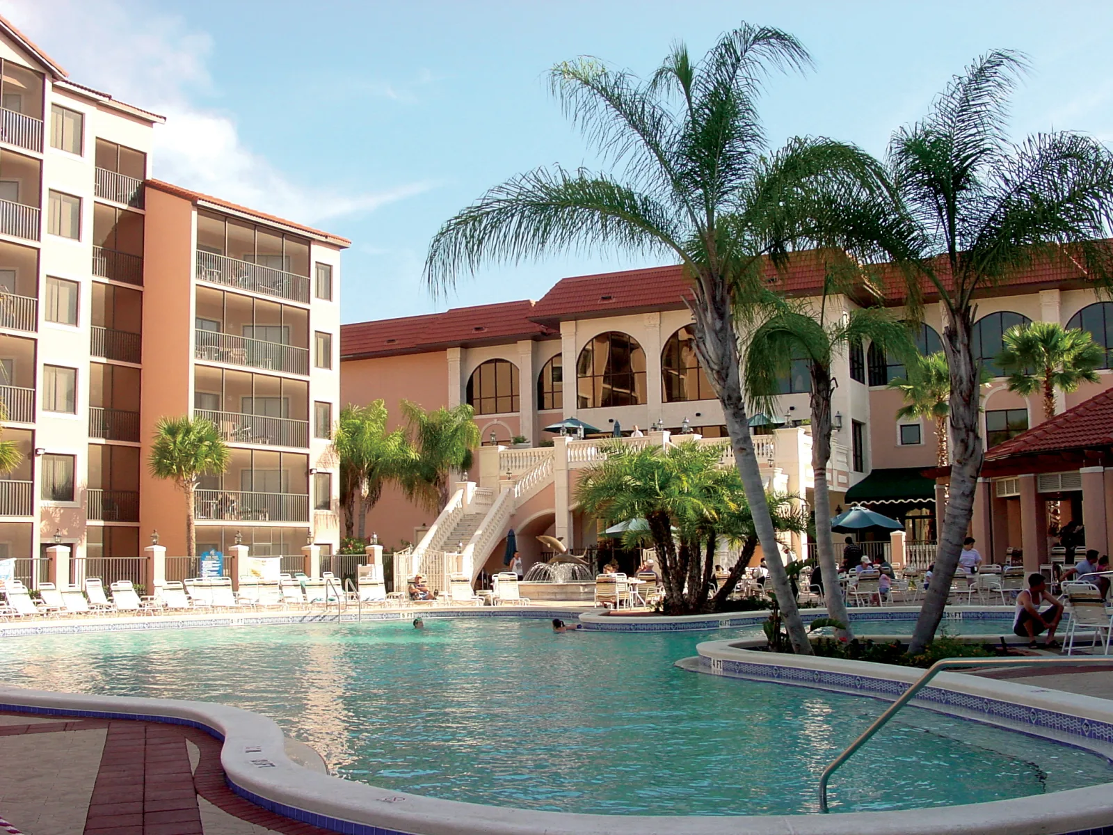 Palm trees beside the pool and villas at a Westgate timeshare resort