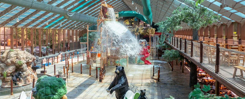 Tipping water bucket, bear statue and walkways inside Wild Bear Falls indoor water park